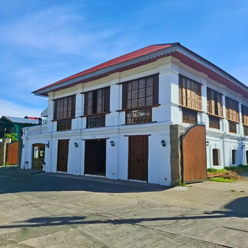 The restored exterior of the Dario Ancestral House in Candon City featuring traditional bahay na bato architecture