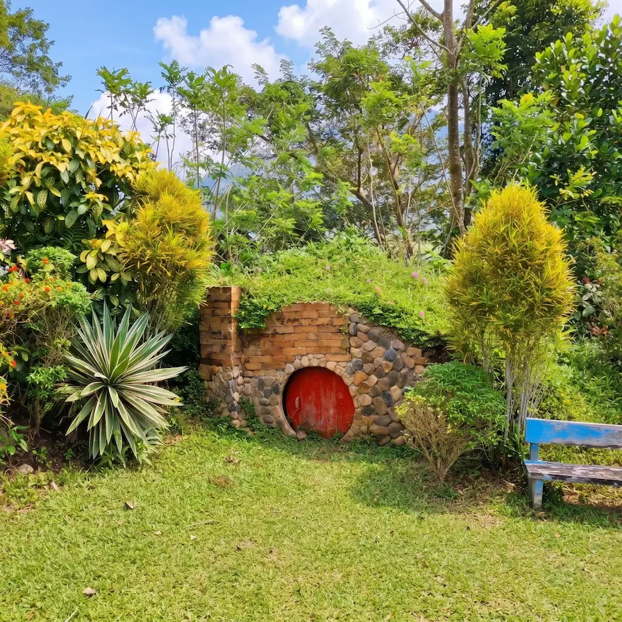 Charming round-door hobbit houses built into the side of a grassy hill in Ligao City Albay