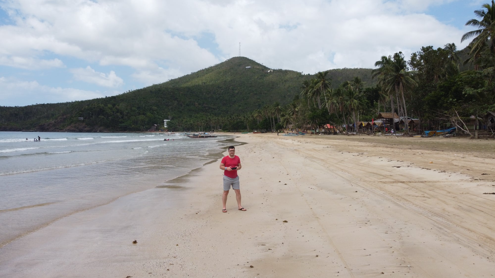 Visitors enjoying the pristine waters of Nagtabon Beach